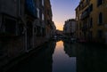 Everyday life of a gondolier. Walking on the bridges of the old city of Venice. Bright sun. The beauty of the ancient city. Italy Royalty Free Stock Photo