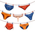 Everyday underwear. Doodle knickers and briefs laundry hanging on ropes. Undies and panties fixed on clothesline with