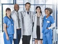 Everyday were doctoring. Portrait of a diverse team of doctors standing together in a hospital.