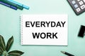 EVERYDAY WORD is written on a white sheet on a blue background near the stationery and the Scheffler sheet. Call to action. Royalty Free Stock Photo