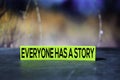 Everyone Has A Story on the sticky notes with bokeh background Royalty Free Stock Photo