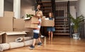 Everyone is helping out. a young family on their moving day. Royalty Free Stock Photo