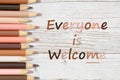 Everyone is Welcome message with multiculture skin tone color pencils crayons Royalty Free Stock Photo