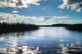 Endless expandes of the lake Seliger and glossy water surface under the blinding sunlight. Tver region, Russia.