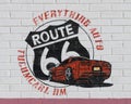 Route 66 mural on gas station brick wall