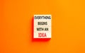 Everything begins with an idea symbol. Concept word Everything begins with an idea on wooden blocks. Beautiful orange table orange Royalty Free Stock Photo