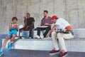 Everything is better when were together. a group of skaters having lunch together.