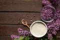 Everything prepared for homemade lilac sugar - Purple lilac flower, wooden spoon, sugar