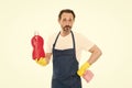 Everything should be perfect. Cleaning service and household duty. Man in rubber gloves hold bottle liquid soap chemical