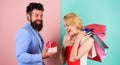 Everything she wants. Man bearded hipster hold gift box and girl enjoy shopping. Ask man to purchase lots presents for