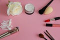 Makeup brushes and lipstick on a pink background Royalty Free Stock Photo