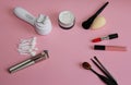 Makeup brushes and lipstick on a pink background Royalty Free Stock Photo