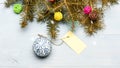 Everything you need to decorate christmas tree. Christmas holidays concept. Decorative ball toy and gift tag copy space Royalty Free Stock Photo