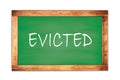 EVICTED text written on green school board