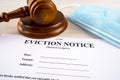 Eviction notice, notice to quit document with facial mask and gavel Royalty Free Stock Photo