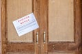 Eviction notice pasted on the entrance door of the house Royalty Free Stock Photo