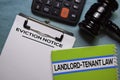 Eviction Notice text on Document form and book Landlord-Tenant Law isolated on office desk. Royalty Free Stock Photo