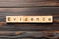 Evidence word written on wood block. evidence text on table, concept Royalty Free Stock Photo