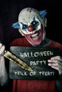 Evil clown and text Halloween party trick or treat Royalty Free Stock Photo