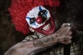 Evil clown with the word Halloween in his arm Royalty Free Stock Photo