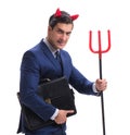 Evil devil businessman with pitchfork isolated on white backgrou Royalty Free Stock Photo