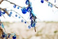 Evil-eye amulets on a branch Royalty Free Stock Photo