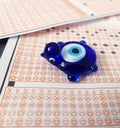 Evil eye bead and optical exam paper, exam and luck