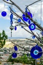 Evil eye charms hang from a bare tree in Cappadocia Royalty Free Stock Photo