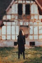 Evil Ghost in Front of a Horror Haunted Abandoned House