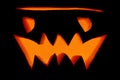 Evil glowing burning pumpkin jack lantern for Halloween on a black background Royalty Free Stock Photo