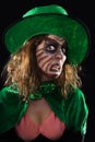 Evil green goblin girl, black background