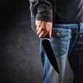 Evil man hold shiny knife, killer in action Royalty Free Stock Photo