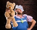 Evil man with teddy bear Royalty Free Stock Photo