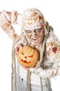 Evil mummy is holding pumpkin