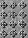 Black and white manhole texture with figures in the form of crosses Royalty Free Stock Photo
