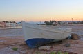 Abandoned fishing boat at twilight on a dried shore in Hurghada, Egypt Royalty Free Stock Photo