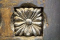 Flower-shaped inlay of old exterior wooden door Royalty Free Stock Photo