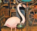 Garden flamingo statue with 70`s ashtray at a vintage market