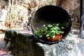 Old pot with clay pot in a garden