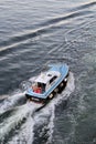 Pilot ship in motion next to the ferry