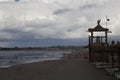 Sandy beach with rough sea and clouds Royalty Free Stock Photo