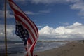 USA flag in the foreground at the beach Royalty Free Stock Photo