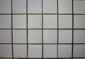 wall texture of white and square tiles Royalty Free Stock Photo