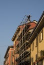 workers engaged in assembling a scaffolding