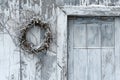 Old white wooden door with a wreath of ivy on it Royalty Free Stock Photo