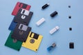 The evolution of digital data storage device. Floppy disks, flash drives and small memory cards Royalty Free Stock Photo