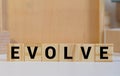 EVOLVE word made with building blocks isolated on white Royalty Free Stock Photo