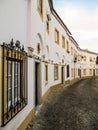 White and yellow traditional houses in Evora, Alentejo region, Portugal