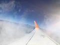 Airplane wing going through a cloud Royalty Free Stock Photo