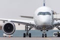 Exactly front view of the cockpit and nose, wing and engine of the aircraft at the airport Royalty Free Stock Photo